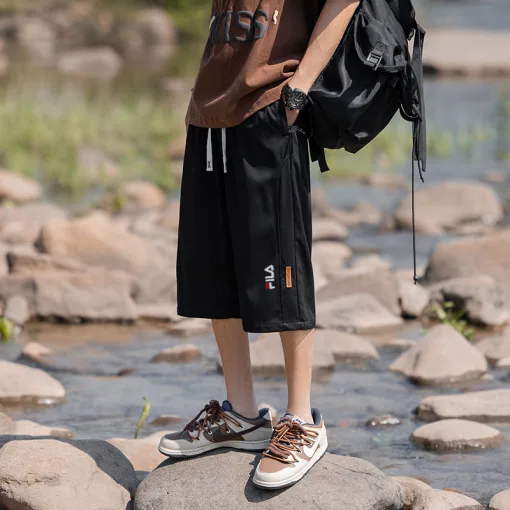 Premium Fila Shorts in Schwarz im Seidenstil