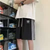 Hochwertiges Adidas Kurzarmshirt mit schwarzen Streifen, Luxus