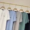 Hochwertiges Fred Perry Kurzarmhemd aus schwarzer Seide im Logo-Stil