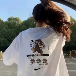 Bestseller: Nike Kurzarm-Shirt in Schwarz mit Baumwolldruck