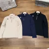 Bestseller Descente Langarmshirt aus schwarzer Baumwolle mit Streifen