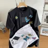 Bestseller: Kurzärmlige schwarze Seidenstickerei-Kollektion von Louis Vuitton