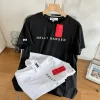 Bestseller Helly Hansen Kurzarm Schwarz Baumwolle Casual Style