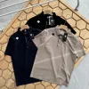 Luxuriöses Descente-Poloshirt aus schwarzer Seide, atmungsaktiver Stil