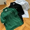 Luxuriöse Lacoste Kurzarm-Kollektion aus grüner Baumwolle