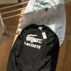 Luxuriöses Langarmshirt von Lacoste aus schwarzer Baumwolle mit Stickerei