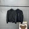 Bestseller Stone Island Mantel in Schwarz mit Stickerei