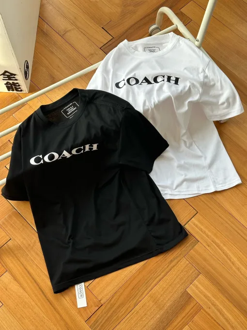 Luxus-Coach-Kollektion mit kurzen Ärmeln und schwarzem Logo