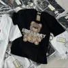 Premium Burberry Kurzarm-Kollektion aus schwarzer Seide