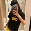 Hochwertige Alo Shorts, gelbe Logo-Kollektion