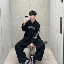 Hochwertiger Balenciaga-Stil mit langen Ärmeln und gelbem Print