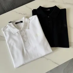 Bestseller The North Face Poloshirt Schwarz Baumwolle Klassischer Stil
