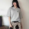 Bestseller: Kurzarm-Kollektion aus grauem Wildleder von Louis Vuitton