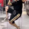 Luxuriöses Gucci-Kurzarmshirt im schwarzen Logo-Stil