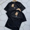 Hochwertige Loewe Kurzarm-Sportbekleidung im schwarzen Logo-Stil