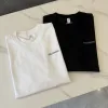 Hochwertiges Salomon Kurzarmshirt aus schwarzer Seide mit Logo-Luxus