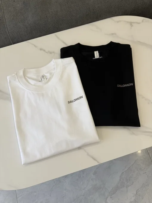 Hochwertiges Salomon Kurzarmshirt aus schwarzer Seide mit Logo-Luxus